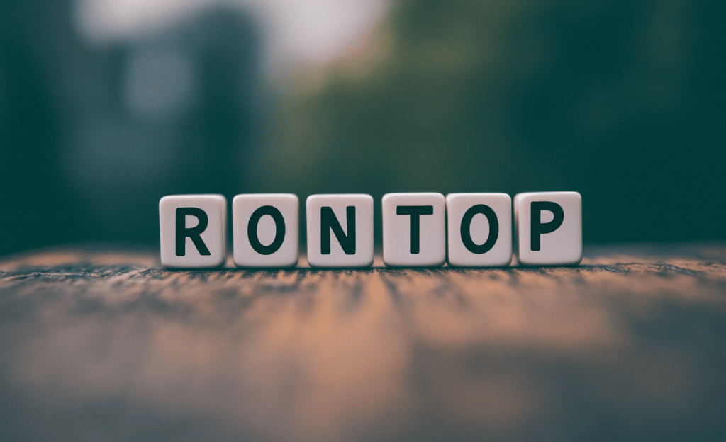 Real estate investment rondseller Green block letters on a wooden table spelling RONTO 2ecf0b89 71be 4c69 ba40 638088d7f60b 1