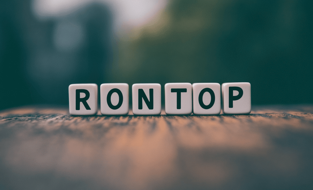 rondseller green block letters on a wooden table spelling ronto 2ecf0b89 71be 4c69 ba40 638088d7f60b